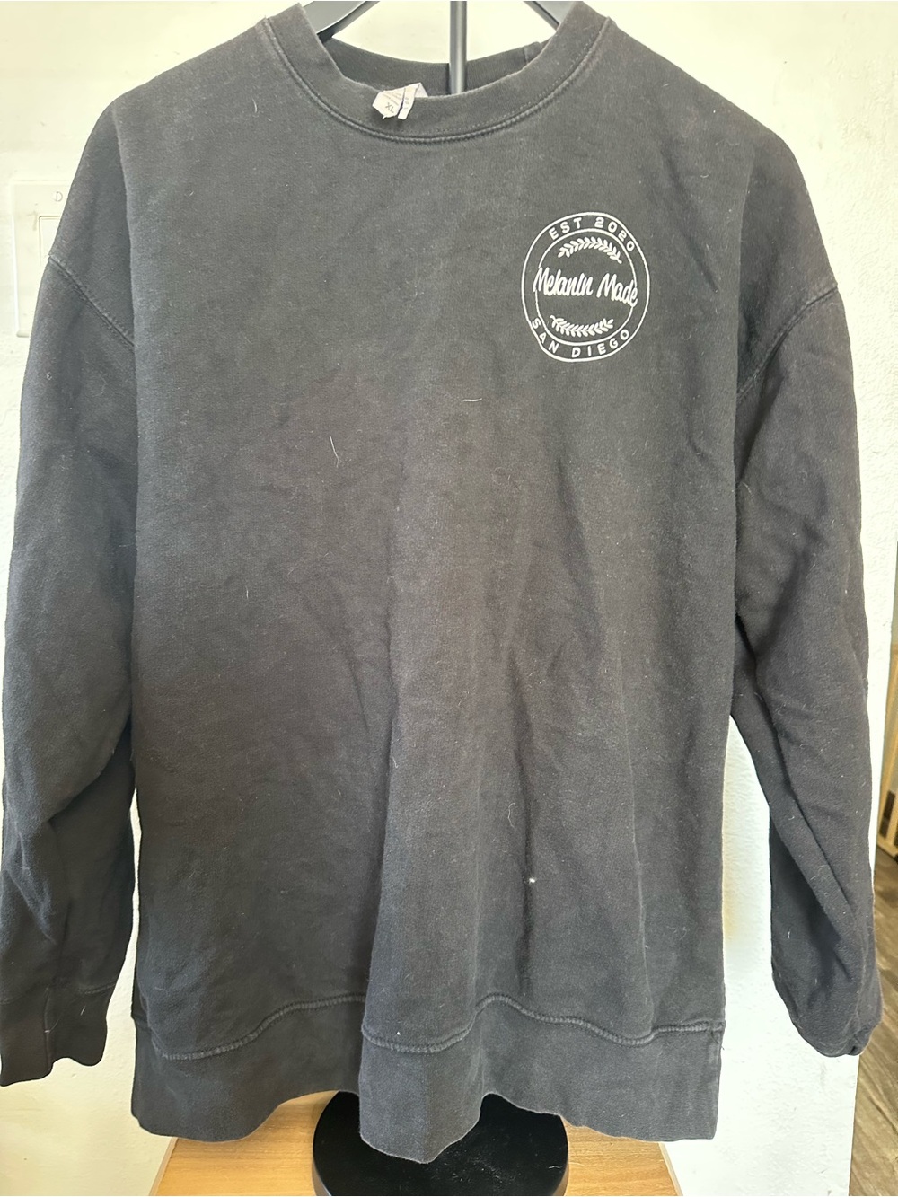 Women’s Black Crewneck Sweatshirt with Chest Logo